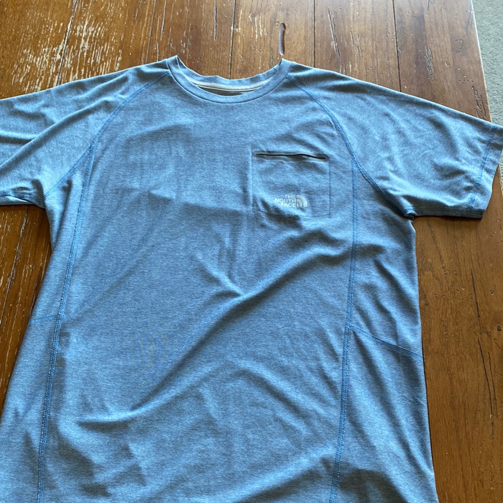 Light blue shirt, north face, size men’s medium